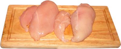 chicken breasts, wooden cutting board